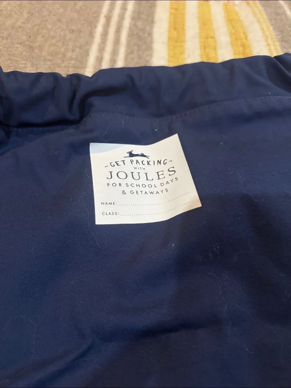 Joules Navy Drawstring Backpack with Rainbow Rays and Horse Motif